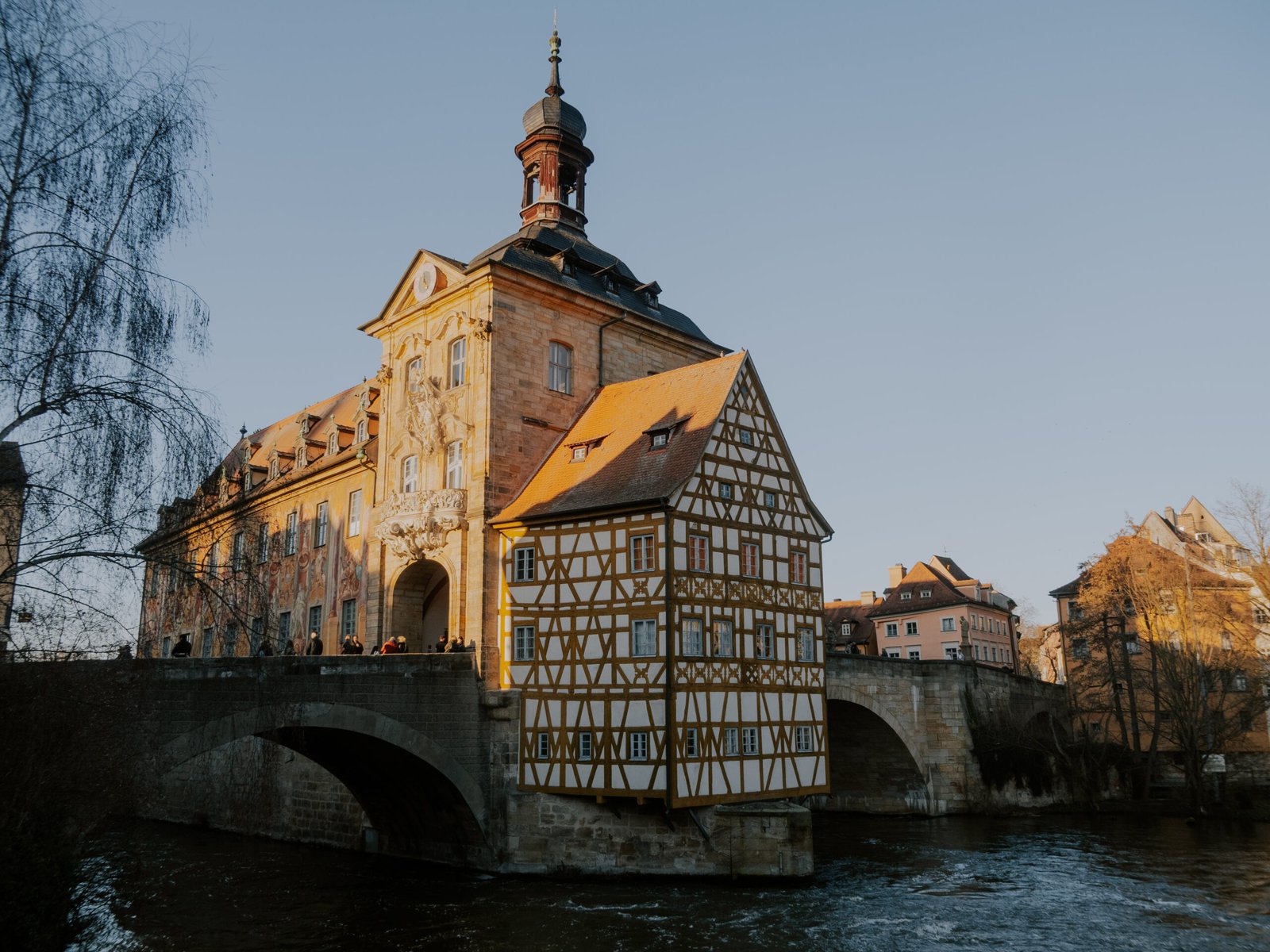 Bamberg's half-timbered Old Town Hall built in the middle of the Regnitz River, golden sunset light