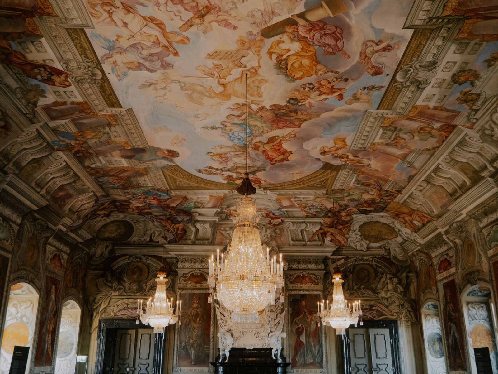 Richly painted baroque ceiling with angel frescoes and crystal chandeliers, New Residence of Bamberg