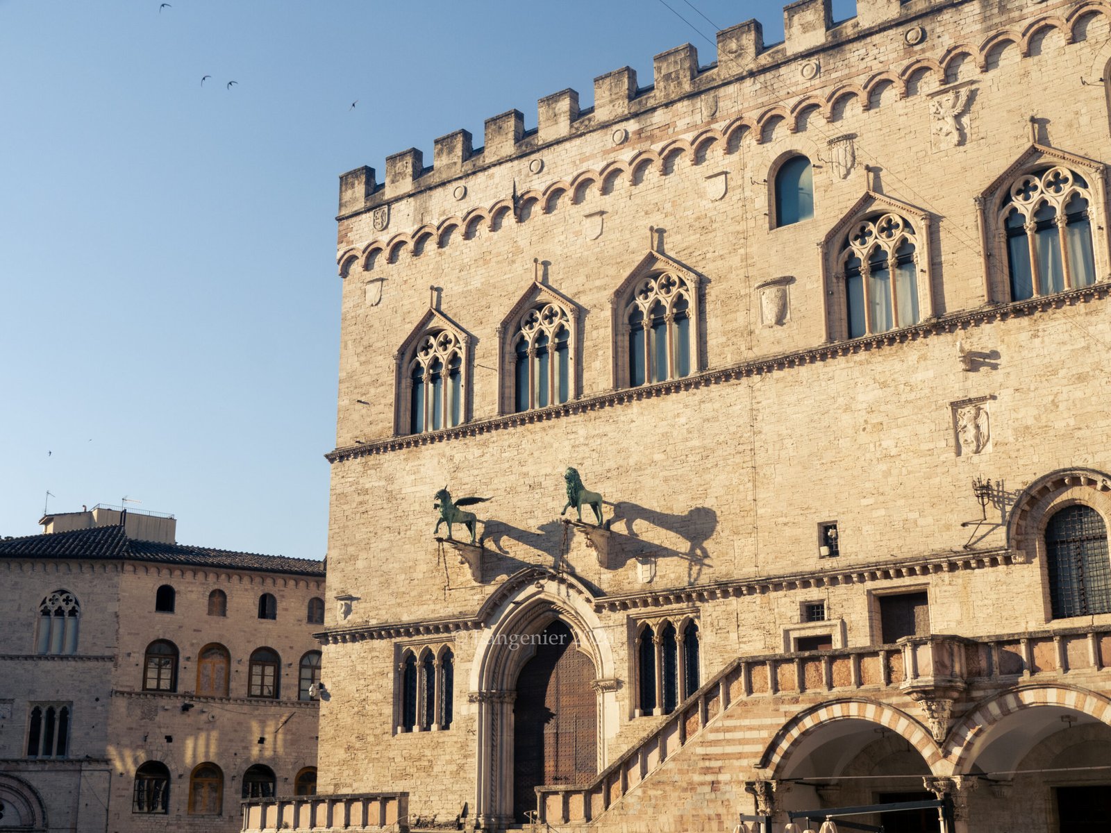 Gothic facade of the Palazzo dei Priori on Piazza IV Novembre in Perugia, with bronze griffons and lions, Umbria