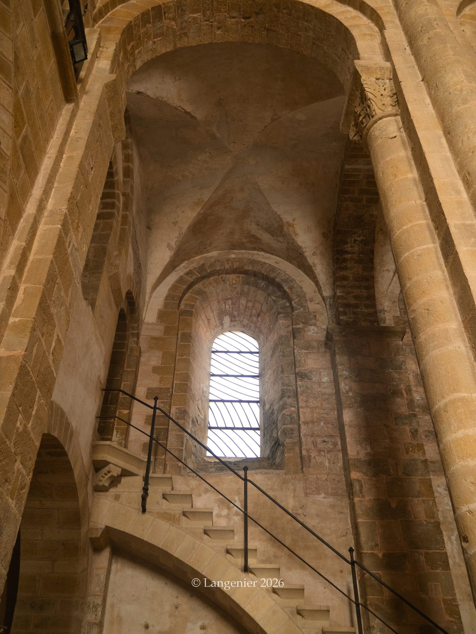 Interior view of the stained-glass windows by Pierre Soulages inside Conques Abbey, Aveyron, France
