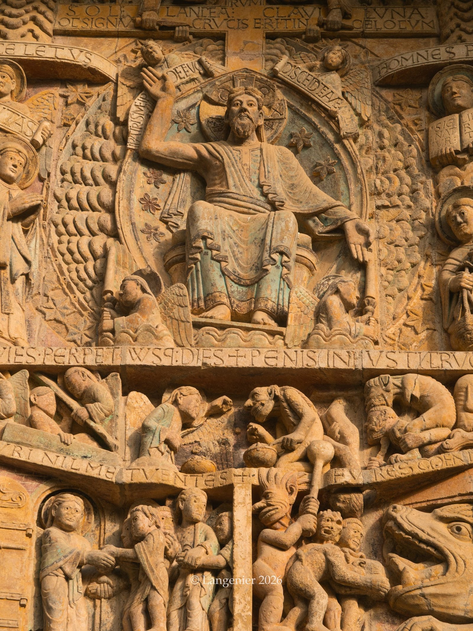 Detail of the medieval Last Judgement tympanum carved above the main door of Conques Abbey, Aveyron, France