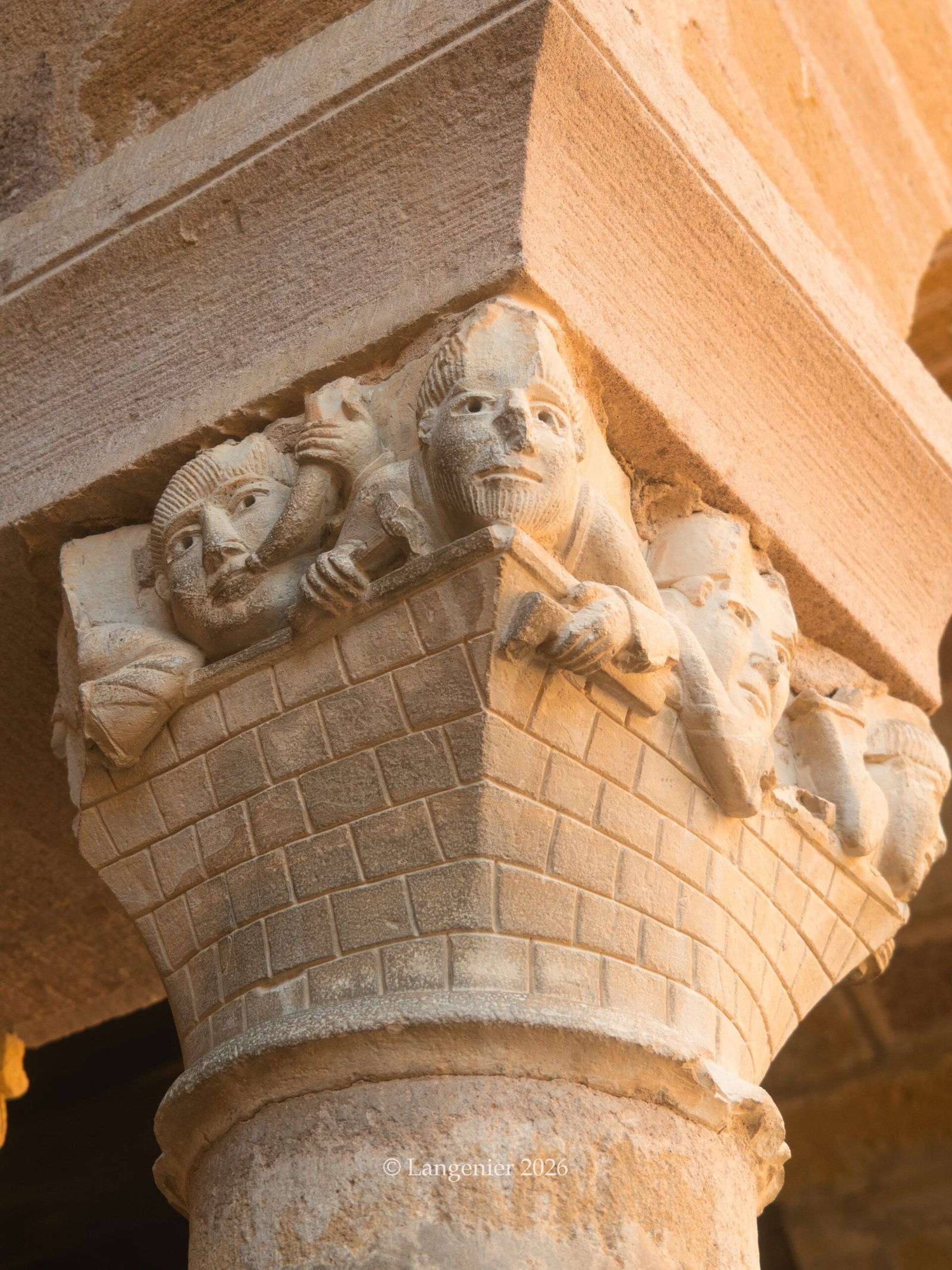 Close-up of the carved stone columns in the cloister of Conques Abbey, Aveyron, France